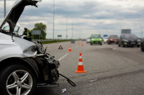 wrecked car in the middle of california freeway